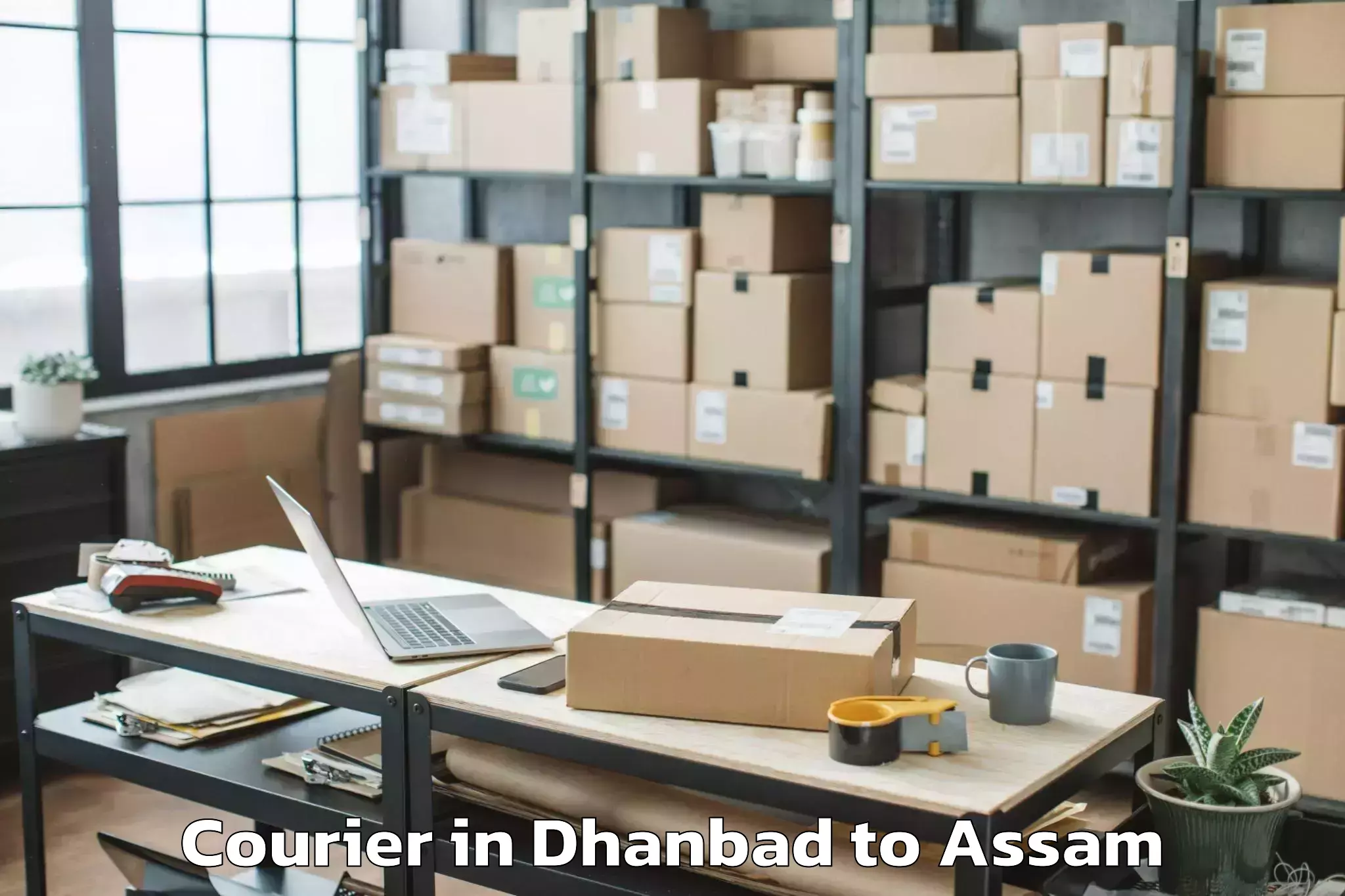 Dhanbad to Marigaon Courier Booking